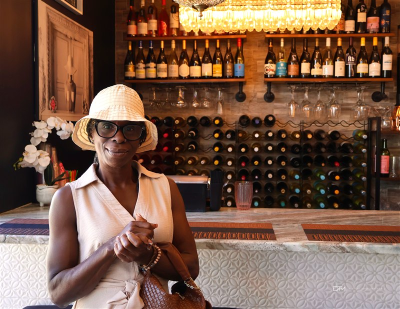 Portrait in a sunlit wine bar