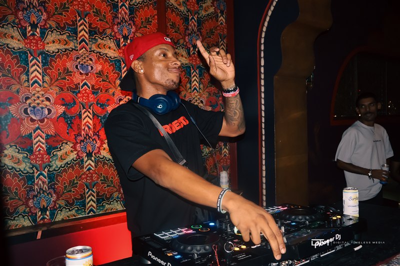 DJ smiling behind the decks